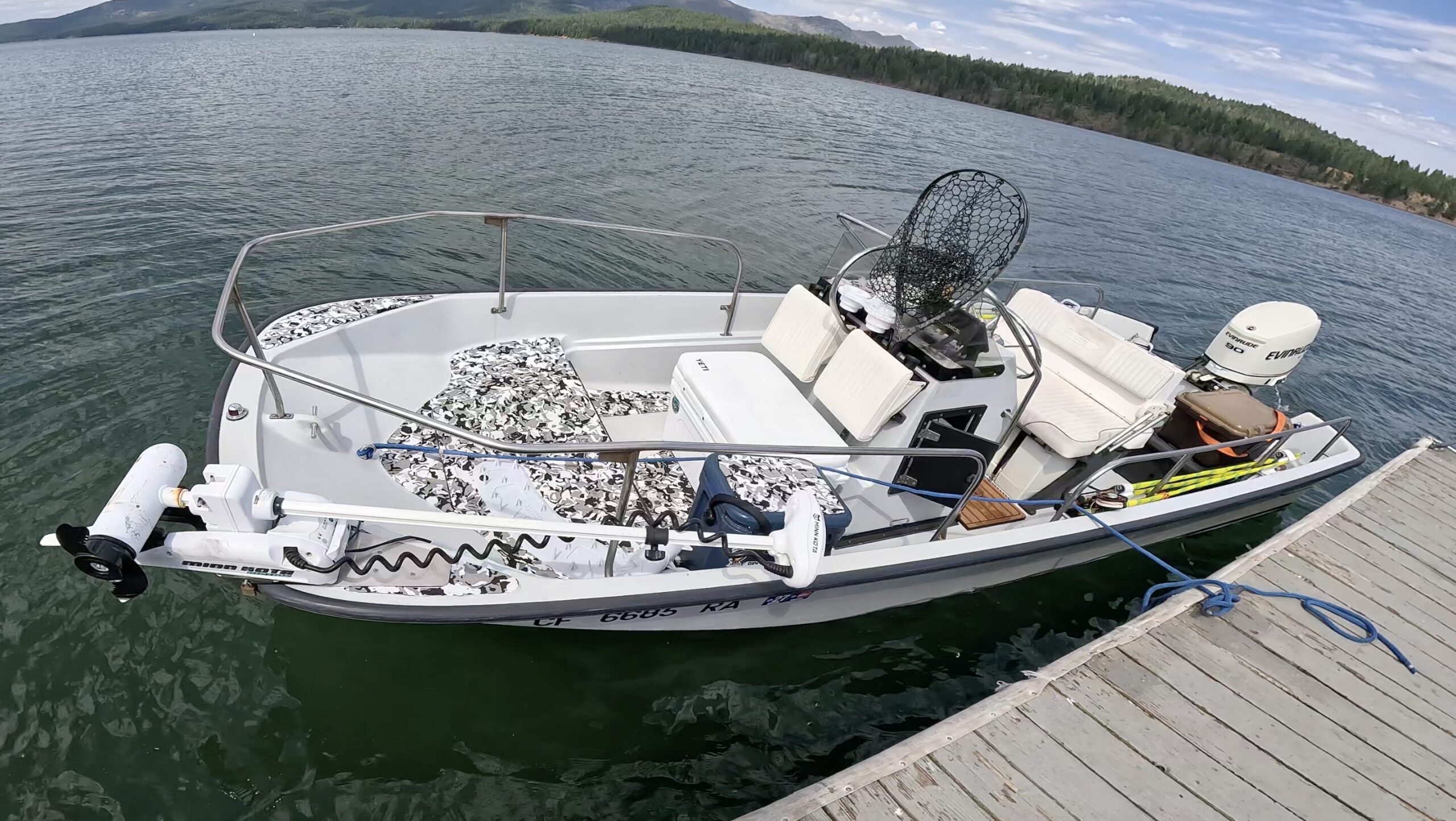 Boston Whaler Montauk boat attached to a dock at Lake almanor