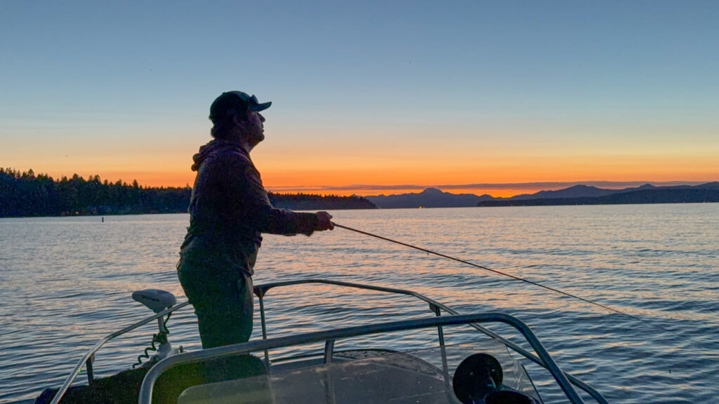 Silhouette of fisherman and a Sunset during Lake Almanor Hex Hatch