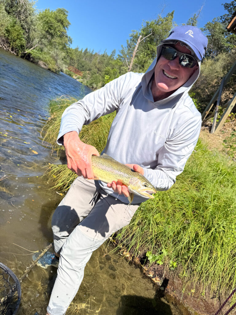 Man holding fish at the Trinity River