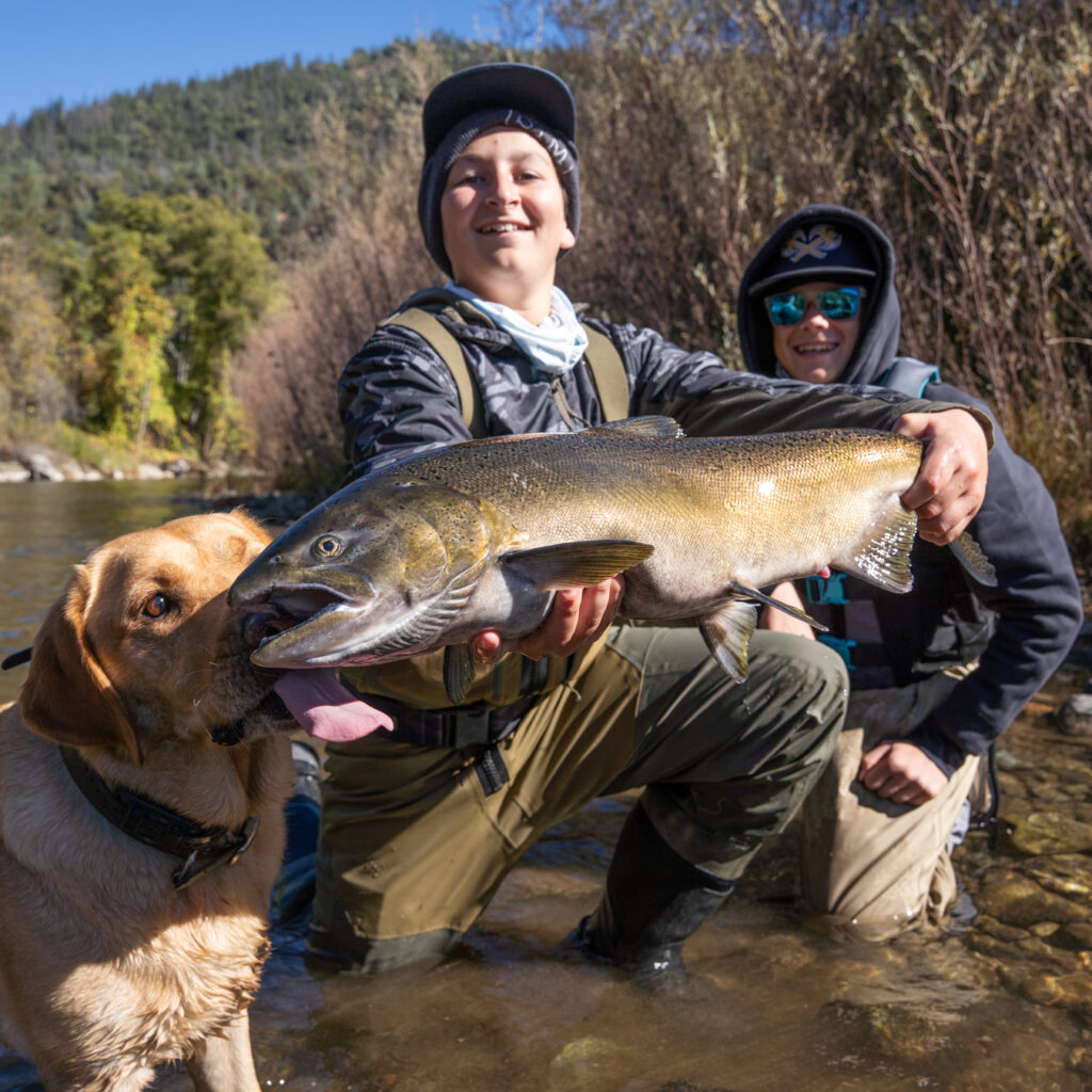 Kids with a Chinook salmon on the Trinity River